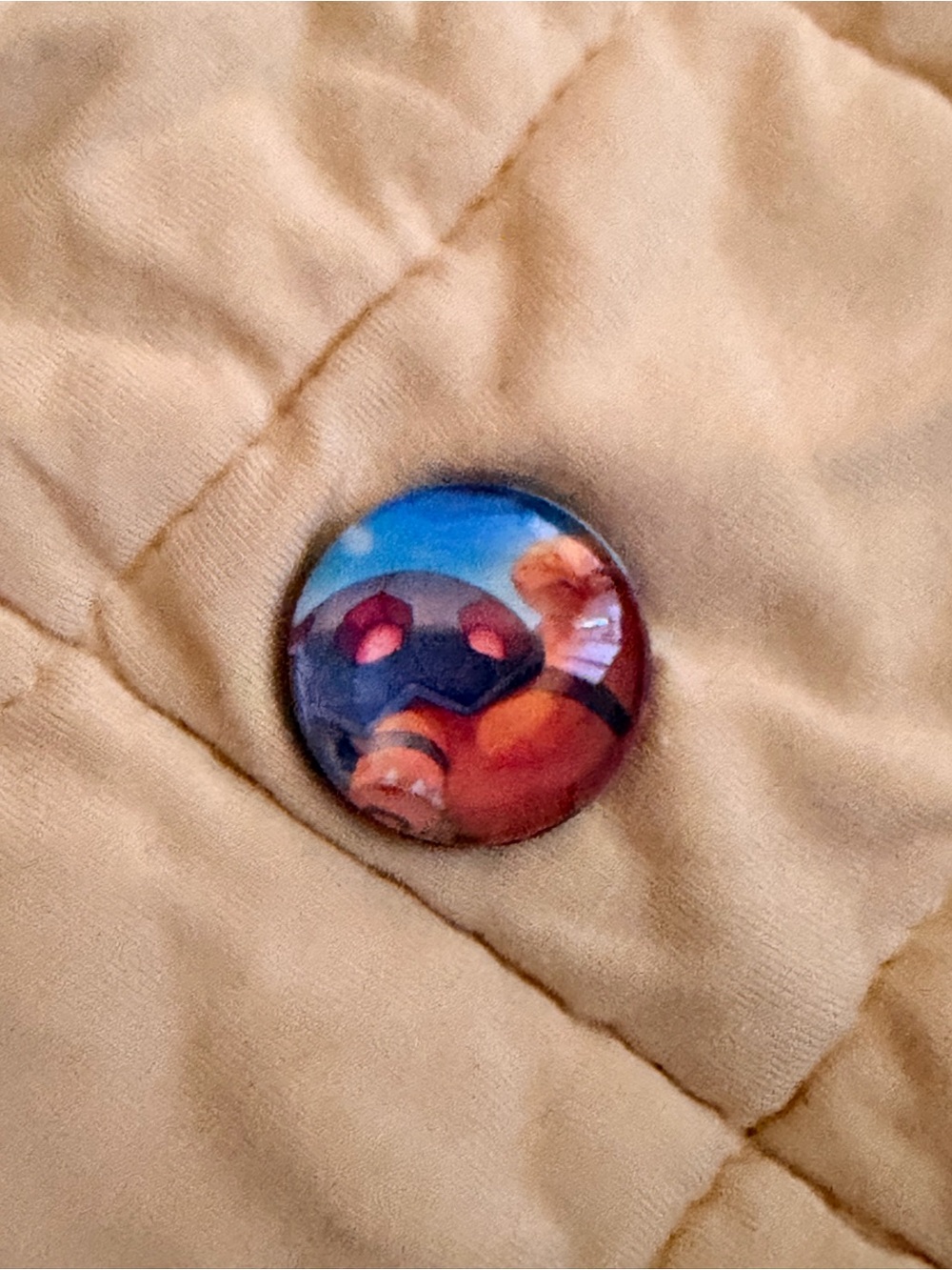 Pokemon Button Pin in Tan with Blue and Red Accents